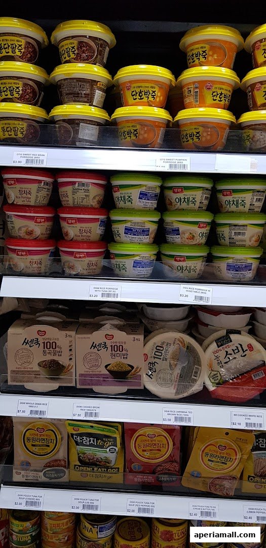 Shelves stocked with various Korean porridges, rice dishes, and tuna products.