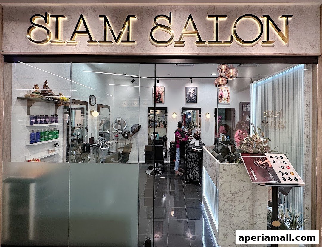 The exterior of Siam Salon, a modern hair salon with stylists working inside.
