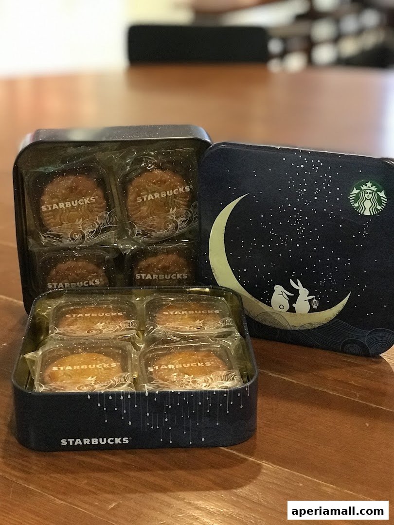 Starbucks mooncakes in a decorative tin featuring a starry night sky and rabbits.