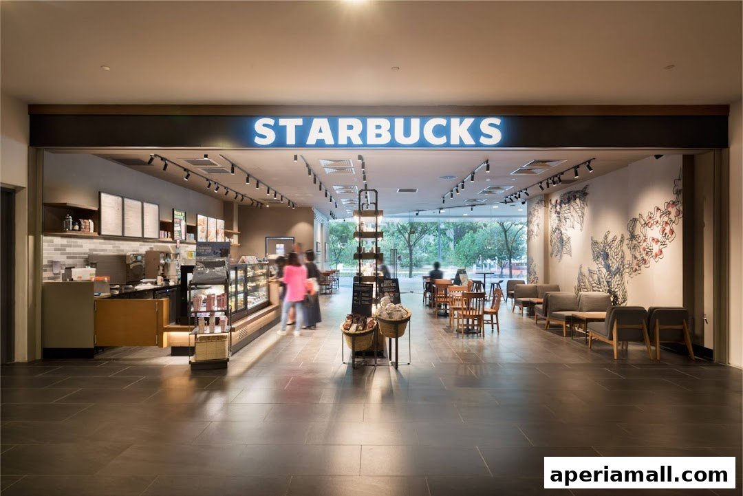 Interior view of a Starbucks coffee shop with seating areas and a counter.