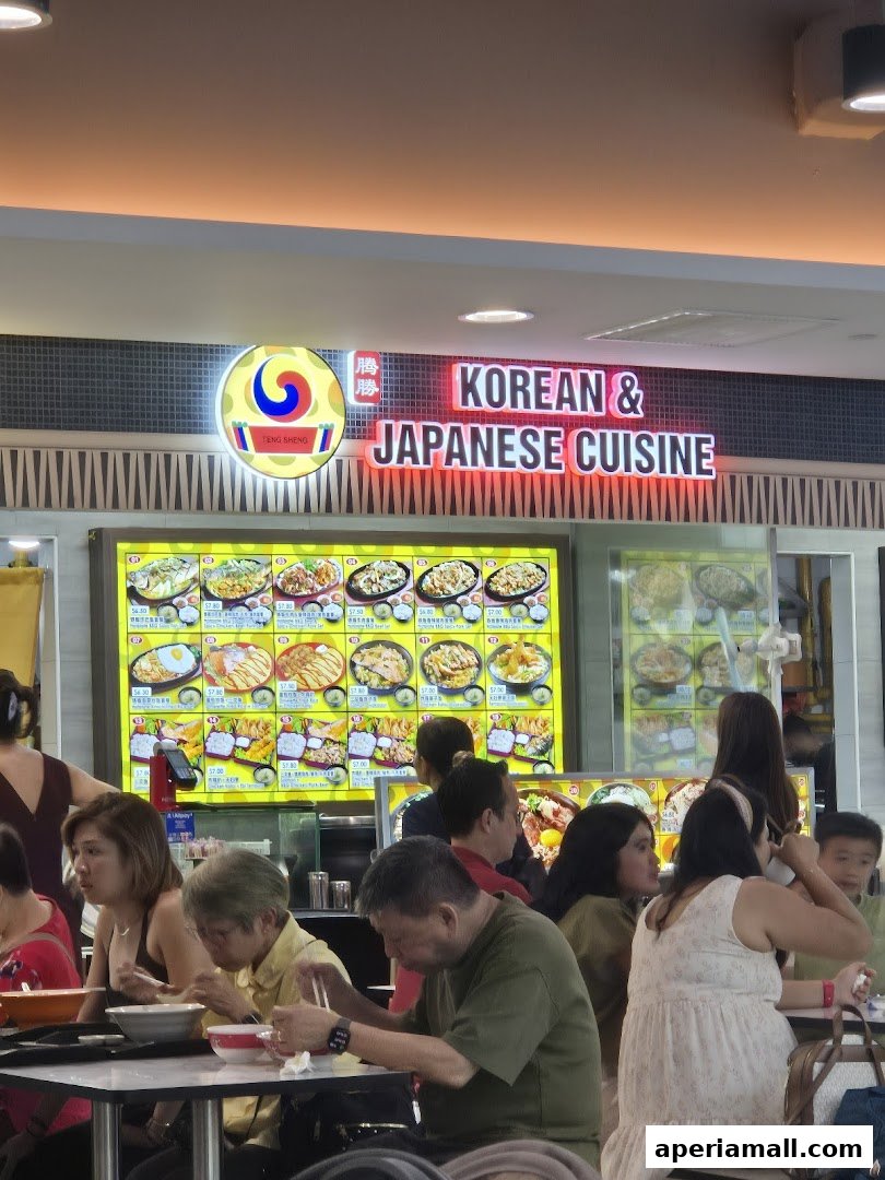 People dining at Teng Sheng Korean & Japanese Cuisine with a vibrant menu display.