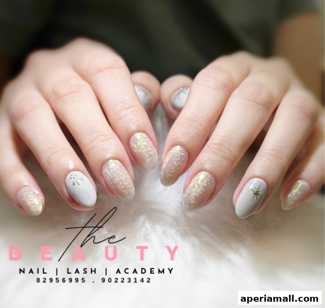 Close-up of a person's hands showcasing elegant, light-colored nails with subtle glitter and star designs.