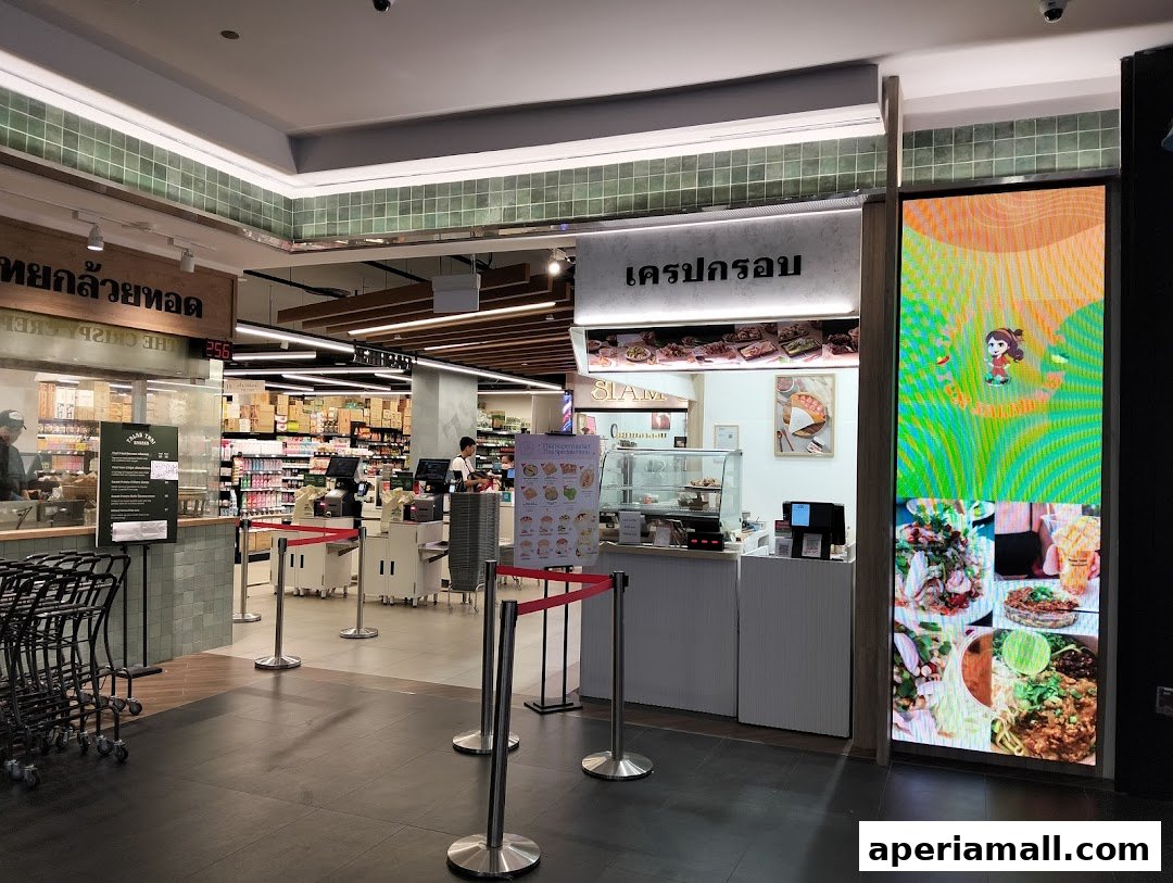 The Crispy Crepes shop entrance with a menu and a digital display showing food.