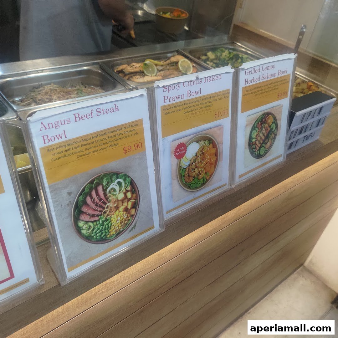 A display of three healthy protein bowls with their names and prices.