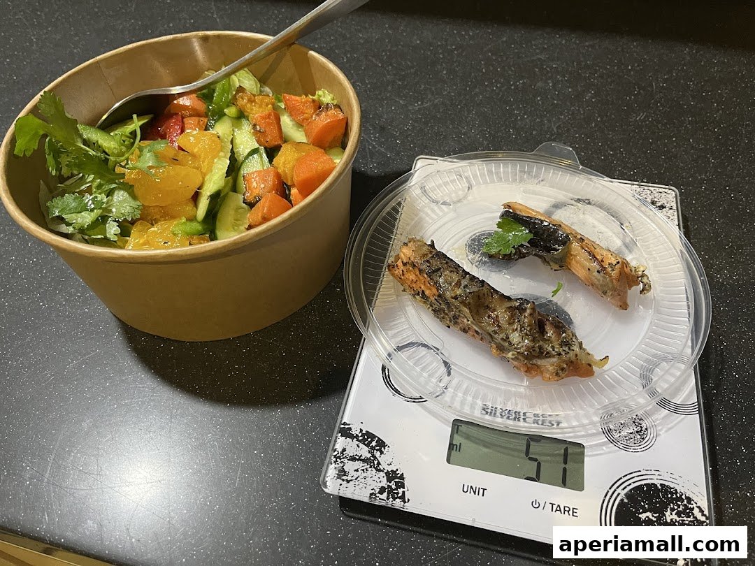 A healthy salad with grilled fish and shrimp on a scale.