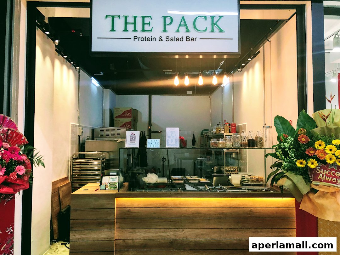 The Pack Protein & Salad Bar storefront with a clean, modern design and fresh ingredients displayed.