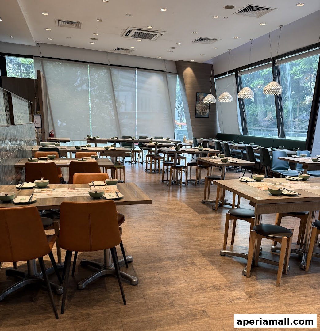 Interior view of a spacious dining area with many tables and chairs set for customers.