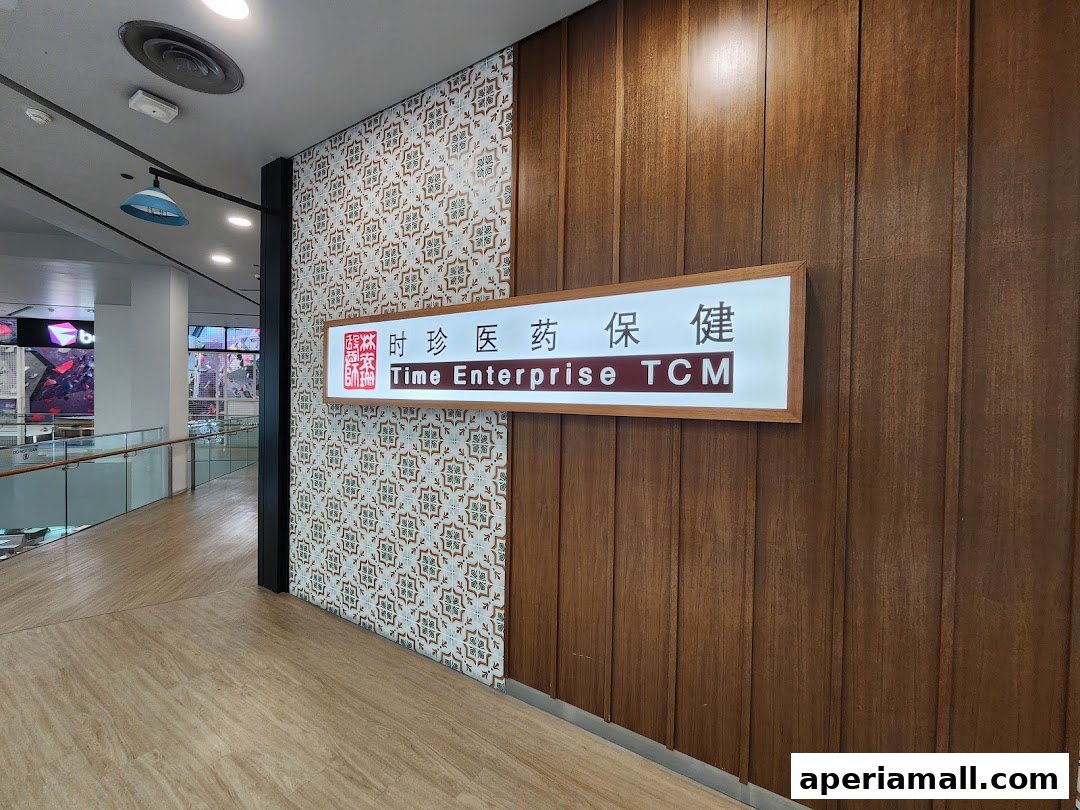 A sign for Time Enterprise TCM is displayed on a wooden wall with patterned tiles.