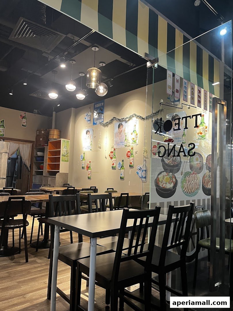 Interior view of a Korean restaurant with tables, chairs, and decorative elements.