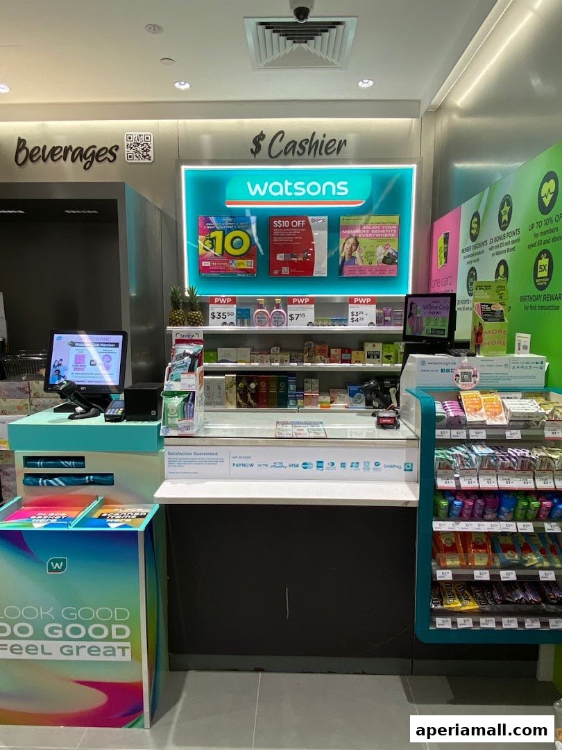 The cashier counter of a Watsons store with promotional displays and various products.