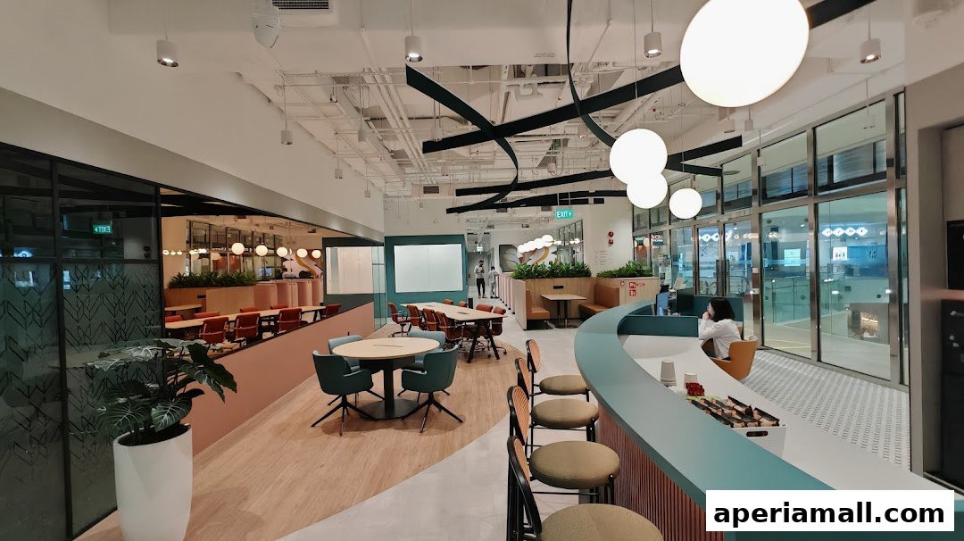 Modern office interior with meeting areas, lounge seating, and a reception desk.