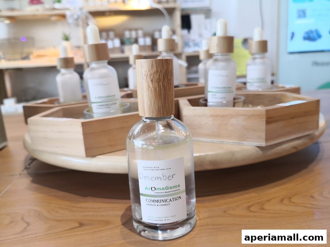 A close-up of a bottle of essential oil with other bottles in the background.