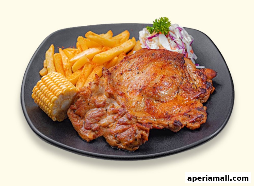 A plate of grilled chicken with fries, corn on the cob, and coleslaw.
