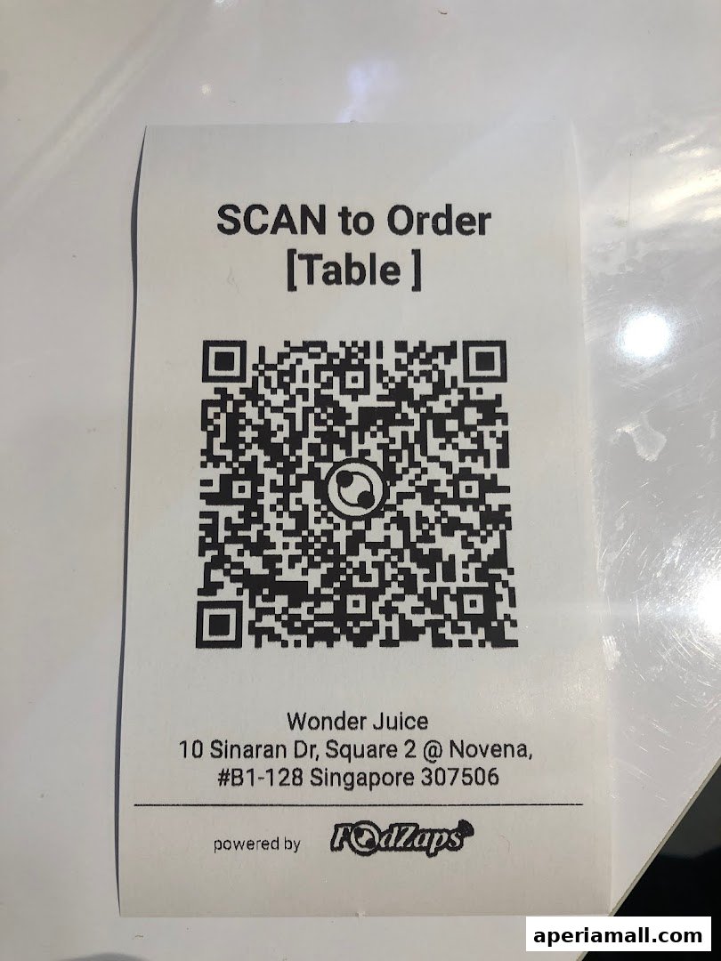A QR code for ordering at Wonder Juice, with the shop's address and powered by FodZaps.