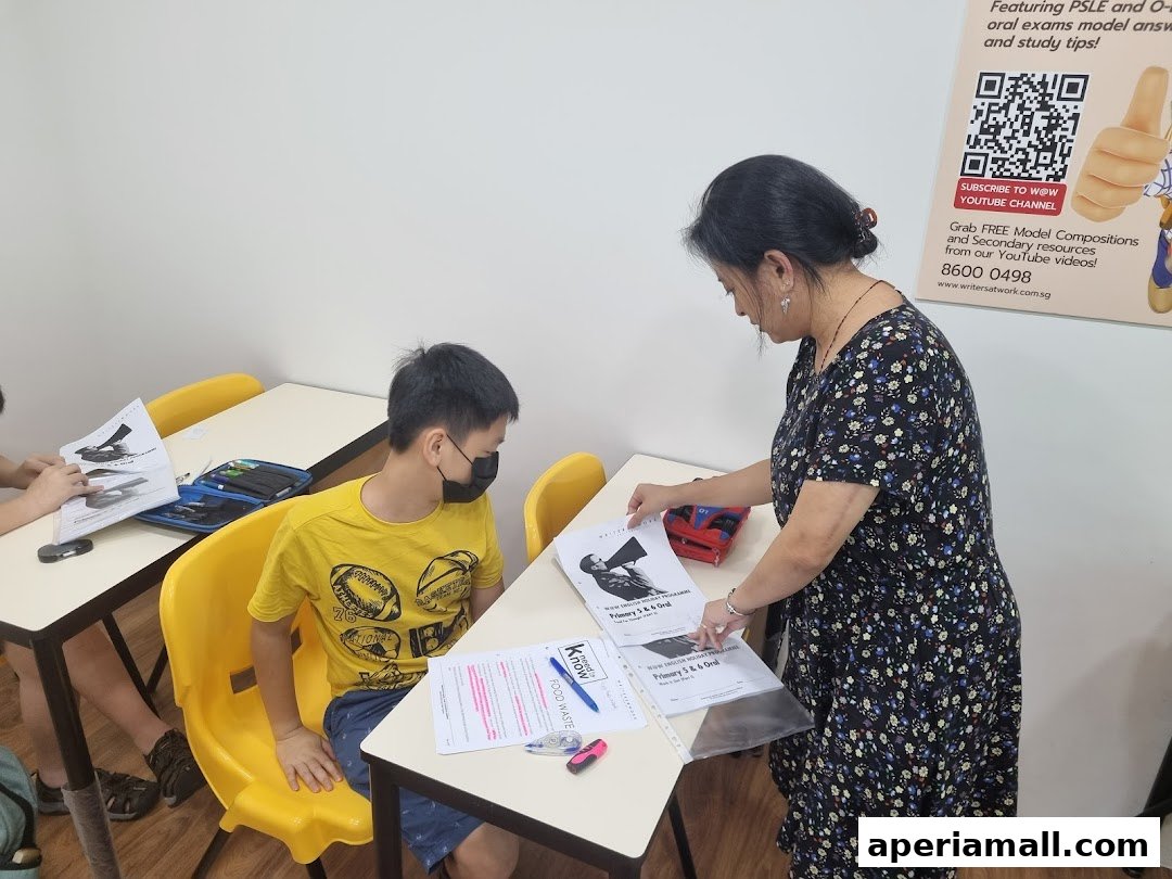 A teacher instructs a student during a writing enrichment class.