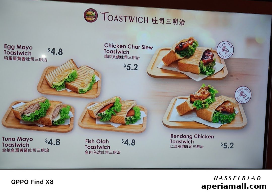 A menu board displaying various toastwich options with prices and images.