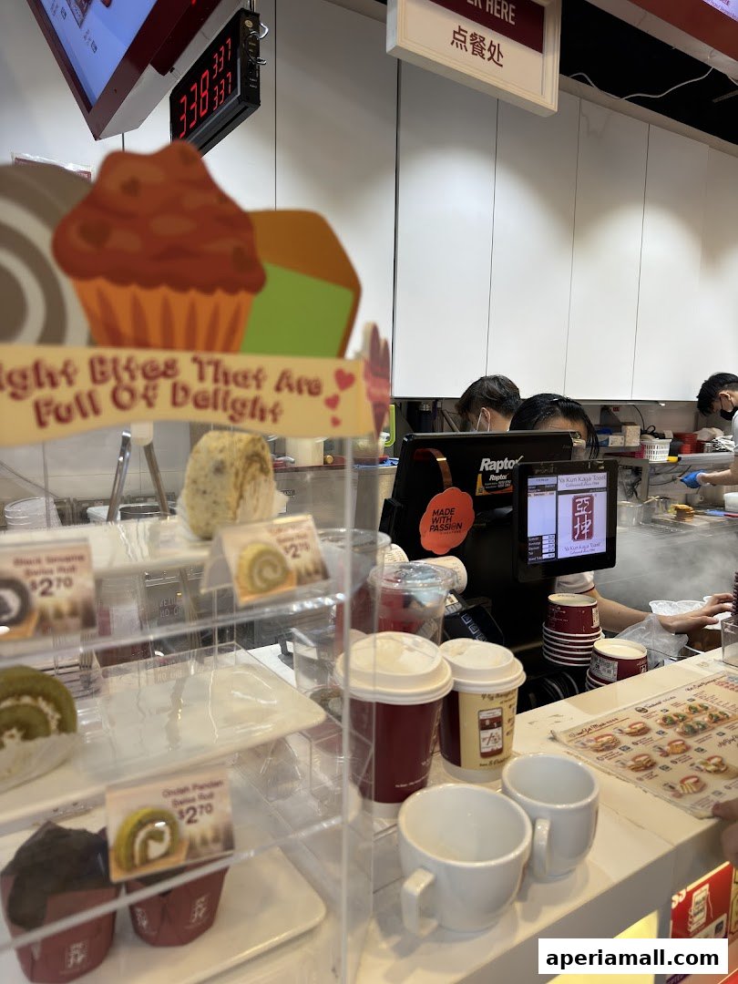 A display case filled with pastries and drinks at Ya Kun Kaya Toast.