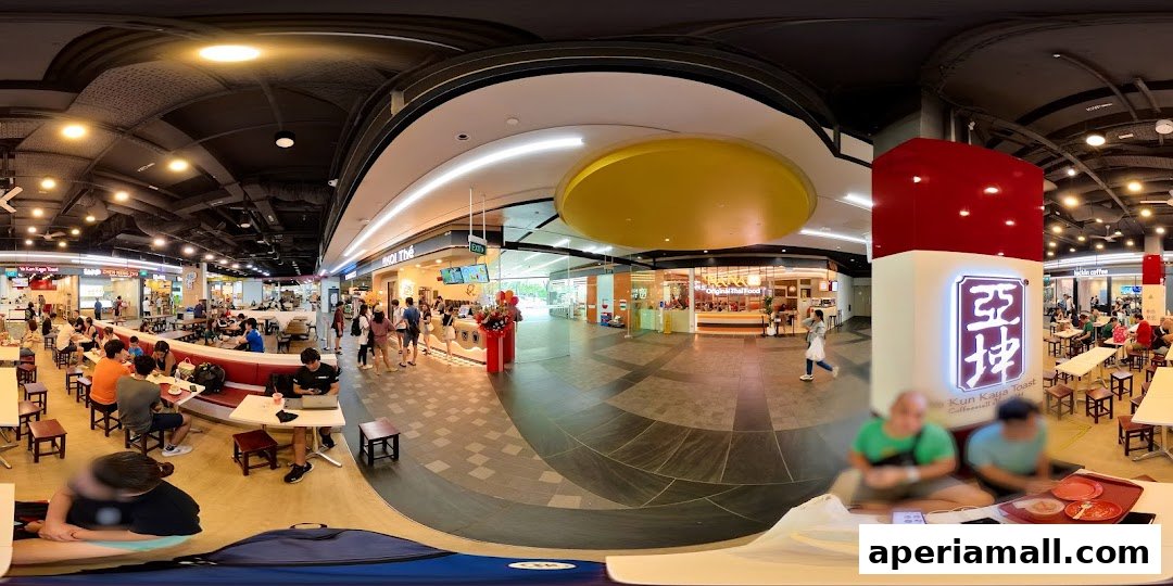A bustling food court with various eateries, including Ya Kun Kaya Toast, filled with diners.