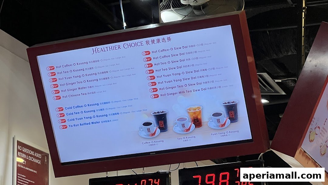 A digital menu board displaying various coffee and tea options at Ya Kun Kaya Toast.