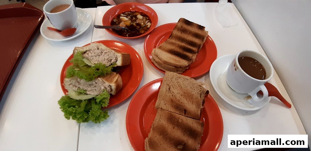 A table with several plates of toast, sandwiches, and cups of coffee.