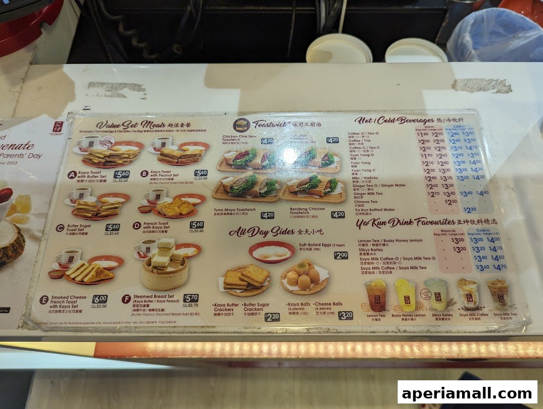 A menu from Ya Kun Kaya Toast featuring set meals, sandwiches, sides, and beverages.