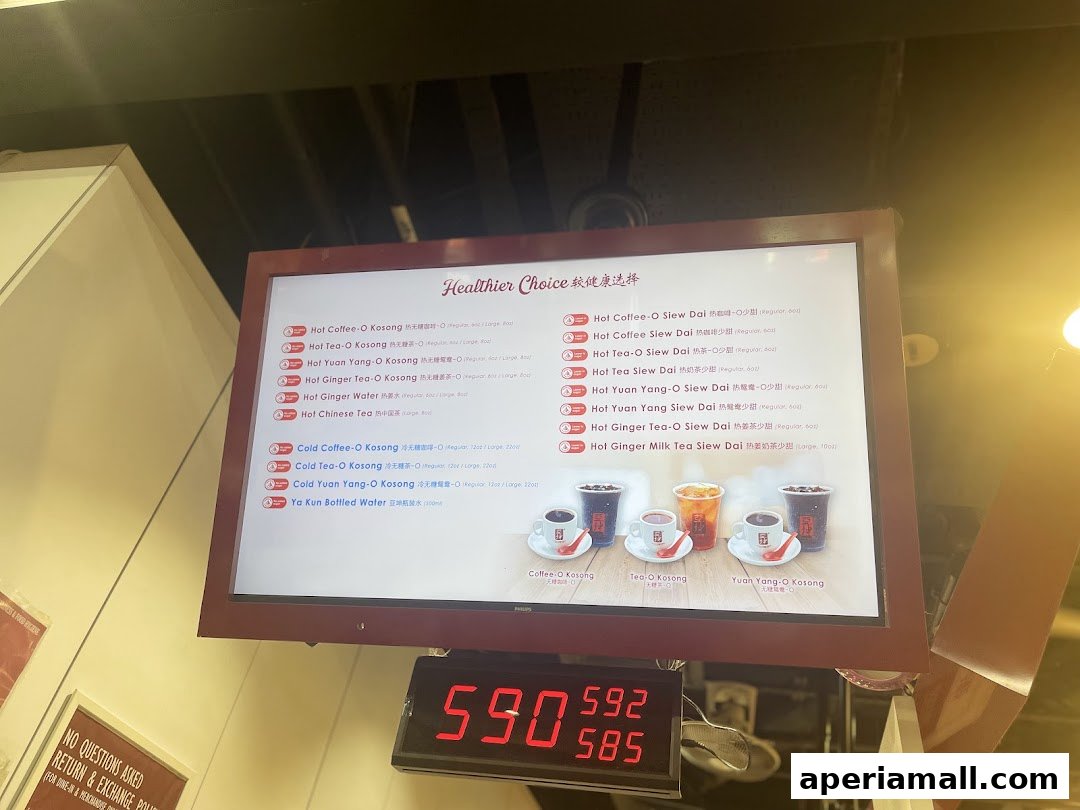 A digital menu board displaying healthier drink choices at Ya Kun Kaya Toast.