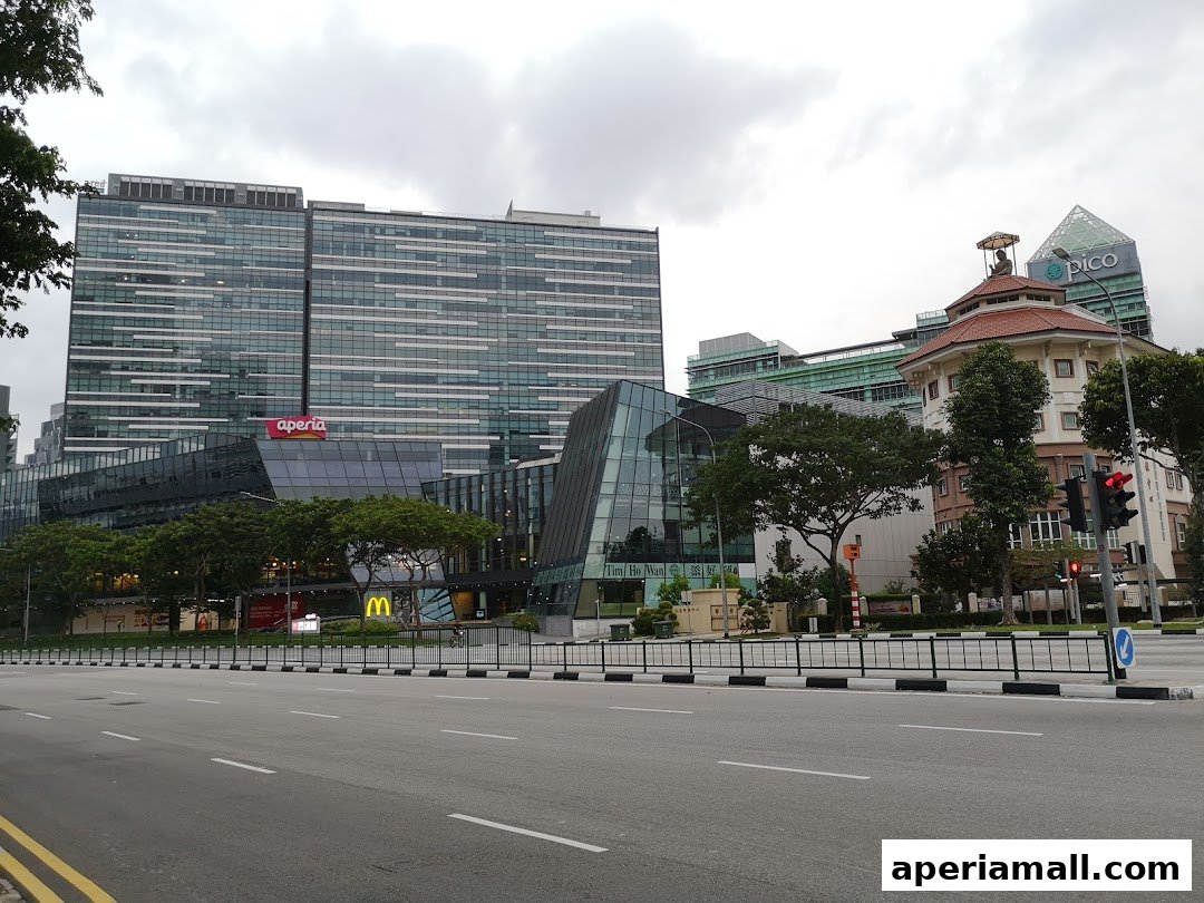 A street view of modern buildings, including a McDonald's and a Pico building.